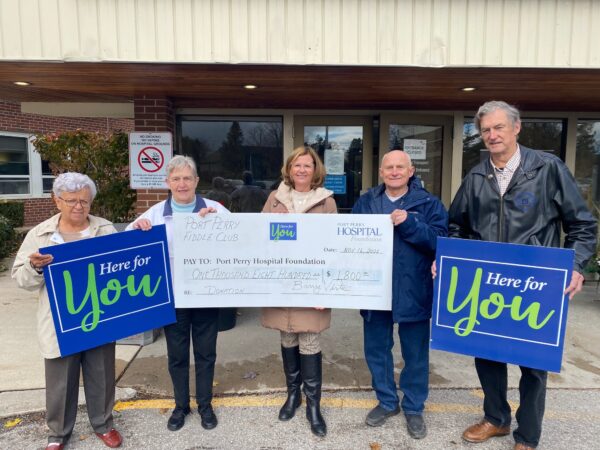 Port Perry Fiddle Club cheque presentation outside the main entrance of the Port Perry Hospital