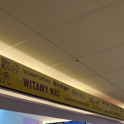 Welcome sign in the many languages of our Durham Community