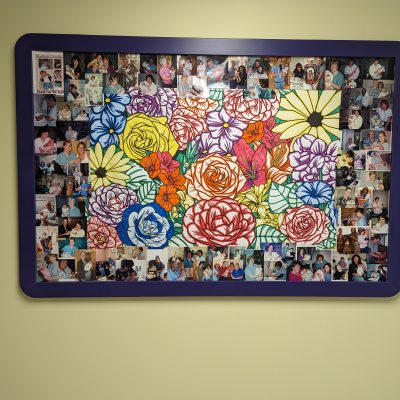 White board with baby pictures surrounding colouring poster