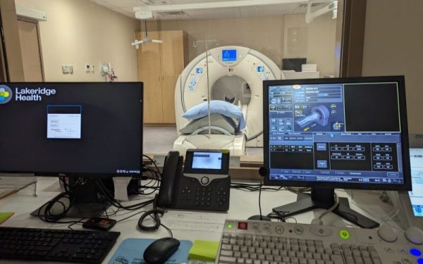 CT rooms looking through the glass with the monitors in the foreground